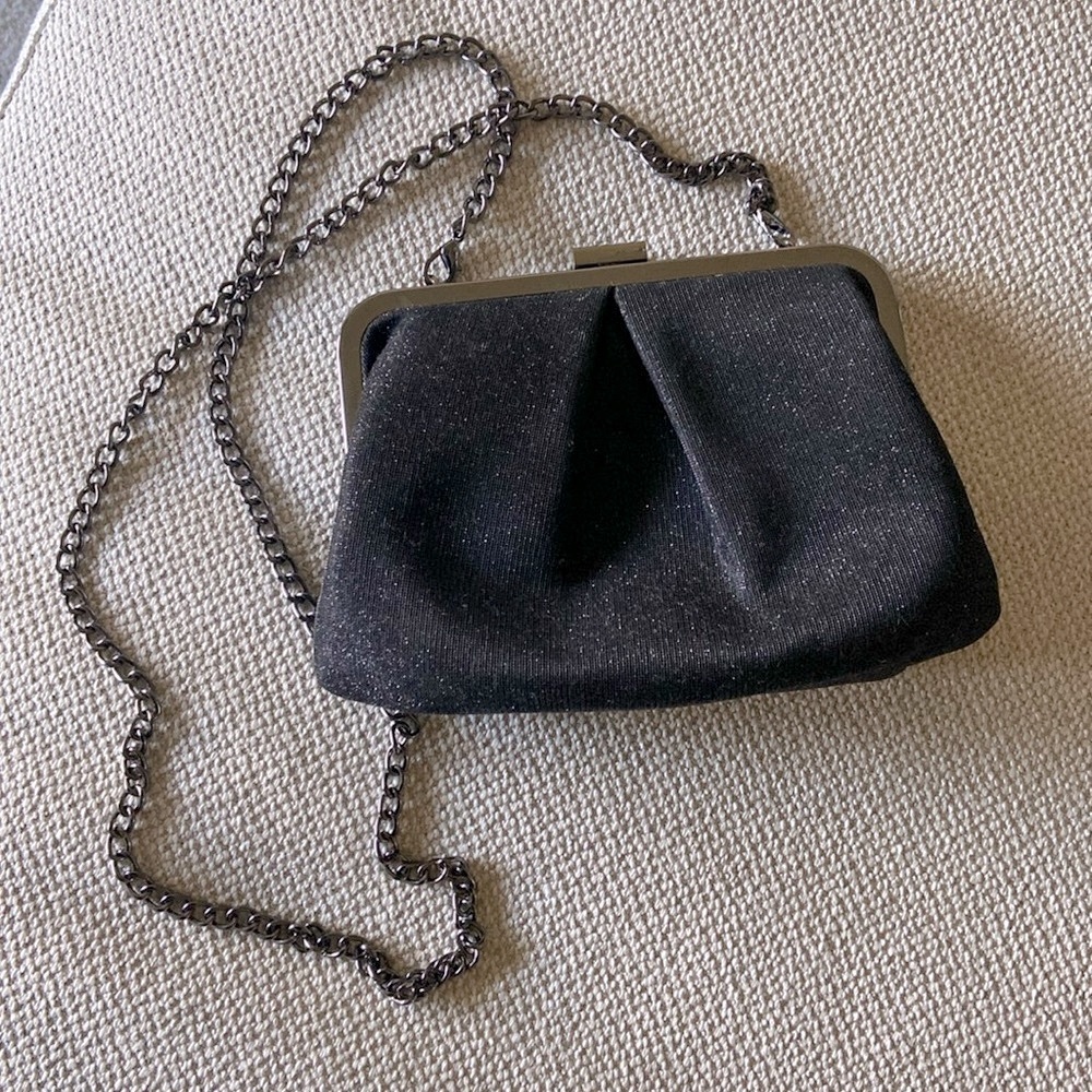 Black special occasion handbag with a bit of sparkle and long shoulder chain